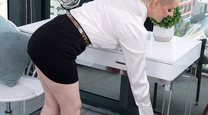 Mature platinum-blonde assistant Bobbi Shay removes her garment to masturbate in high-heels
